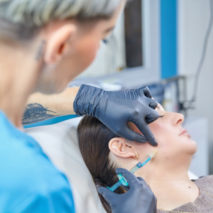 woman receiving cosmetic injections in a clinic with a professional administering treatment for skin rejuvenation and enhancing beauty