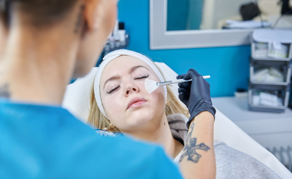 woman receiving facial treatment in a spa setting skincare four steps relaxation