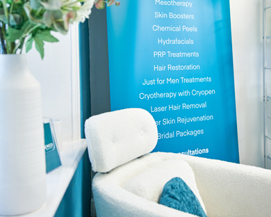 spa interior featuring treatments list for skin rejuvenation including mesotherapy and hydrafacials along with a stylish chair and vase with flowers soothing beauty services 14 treatments options